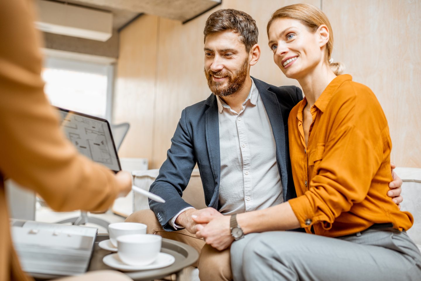 young couple choosing house at the real estate age BX5JDLU e1650789131159