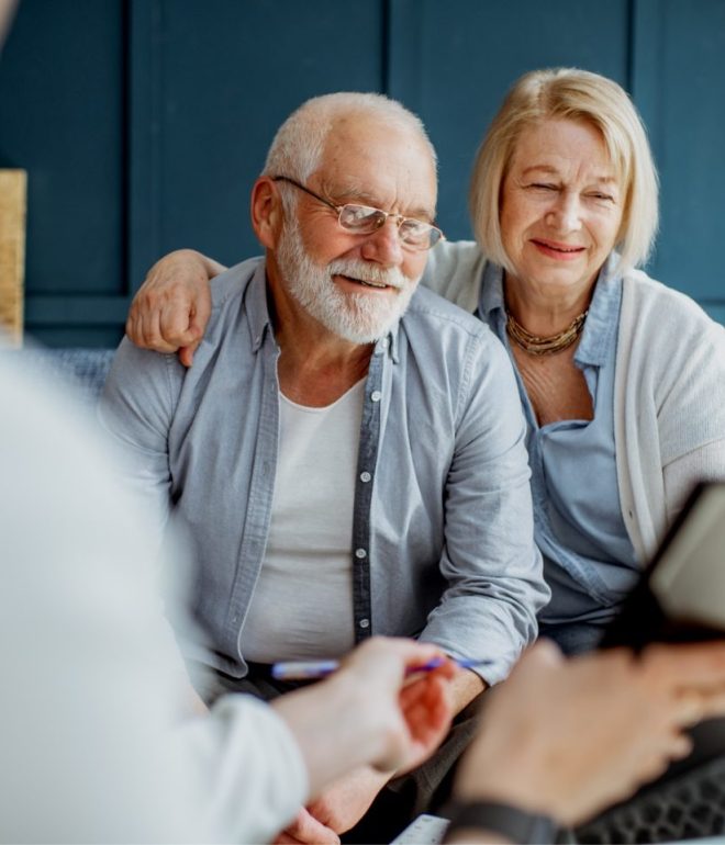 senior couple with consultant at the office 9G94VHN e1650789257166