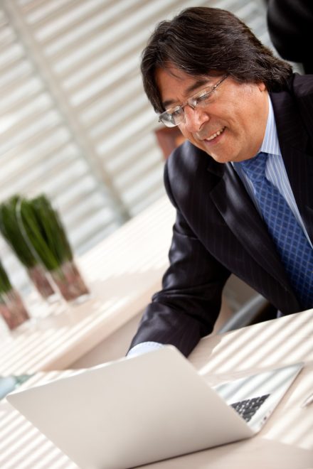 business man working on his laptop at the office
