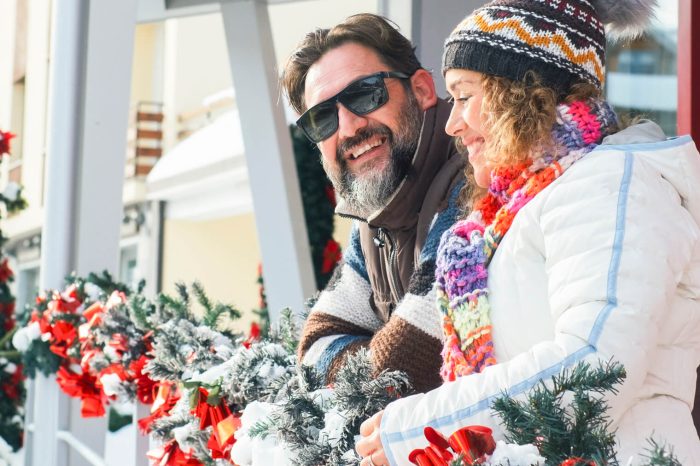 happy couple of young mature tourist outside